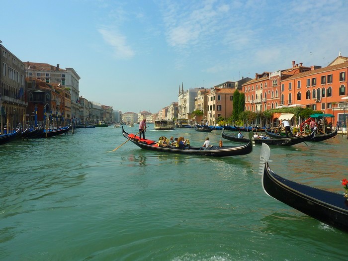 Gondolas driving the tourists through the Grand Canal